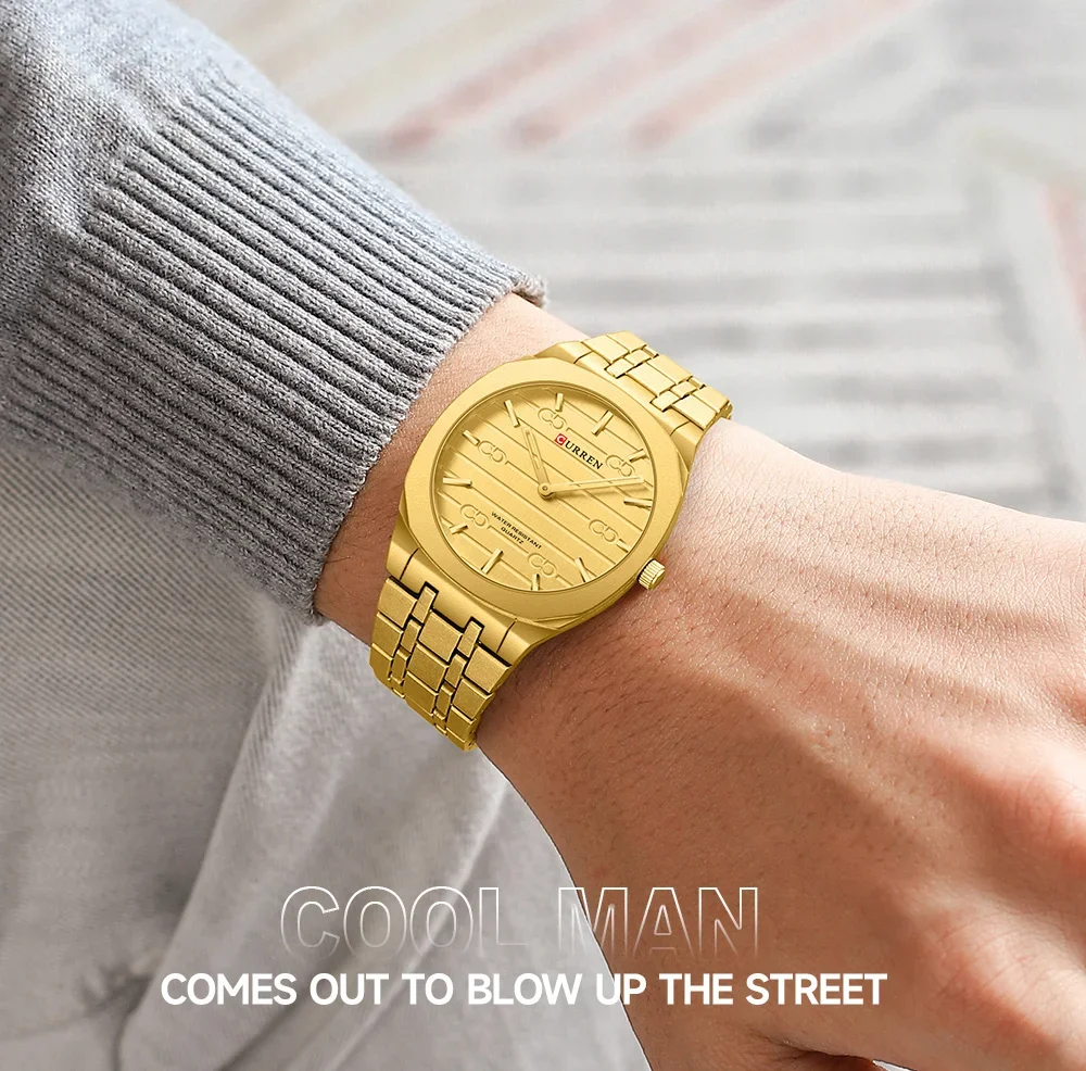 Curren 8444 watch displayed on a desk with business items